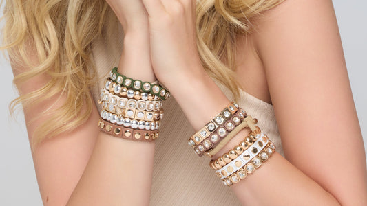 womens bracelets stacked on an arm