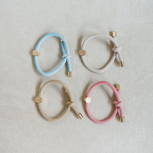 Hair Tie Set set of 4 - knotted hair tie that looks cute on your wrist and in your hair! Knotted detail and gold end caps with jewel center stone. pink , baby blue, light pink and tan, cream