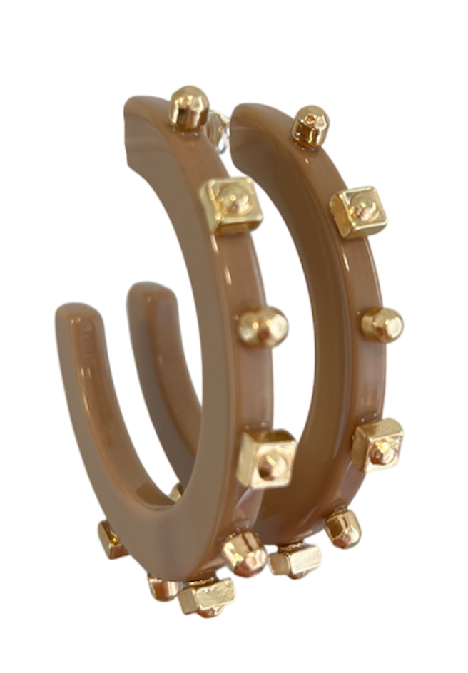 Gold-studded hoop earrings featuring a smooth, taupe-colored finish, blending modern design with bold metallic accents for a chic, sophisticated look.
