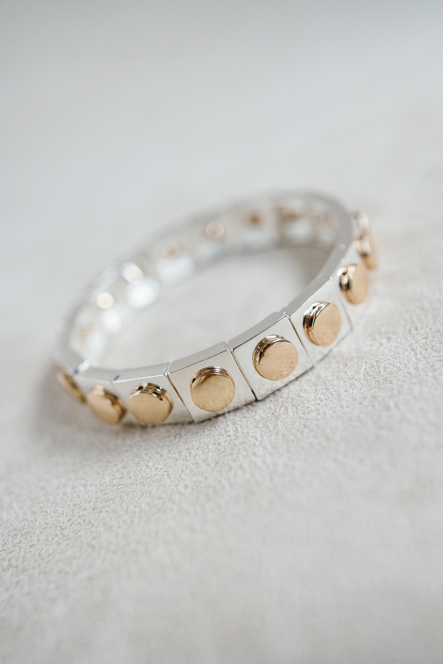 Geometric Enamel Silver Stretch Bracelet with Gold Studs for a timeless and classy look.