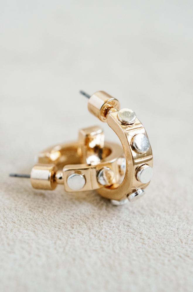 small .5" gold hoop earing with round silver studs