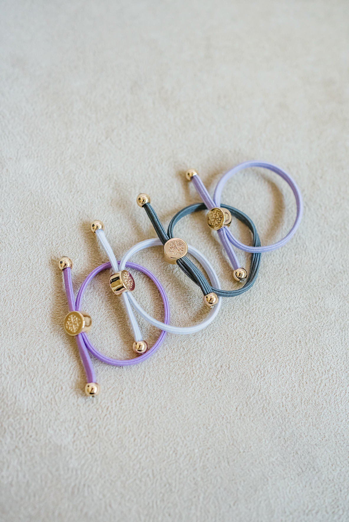 Children/Kids hair tie sets sold as set of four in purple.