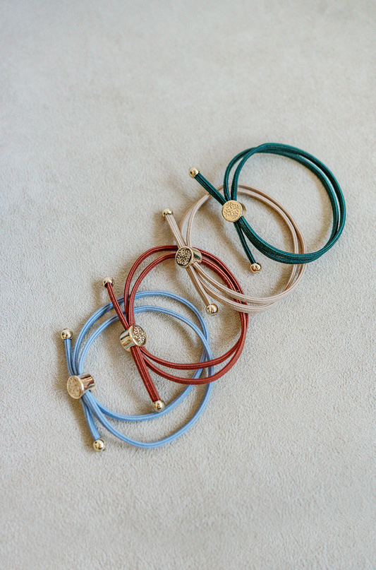 Two in one sleek hair tie bracelet set in dark green, khaki, rustic red and dusty blue.