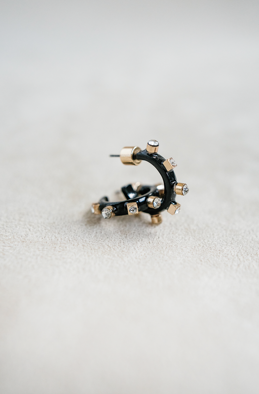 half inch metal huggie mini hoop earring. black huggie hoop with rhinestones.