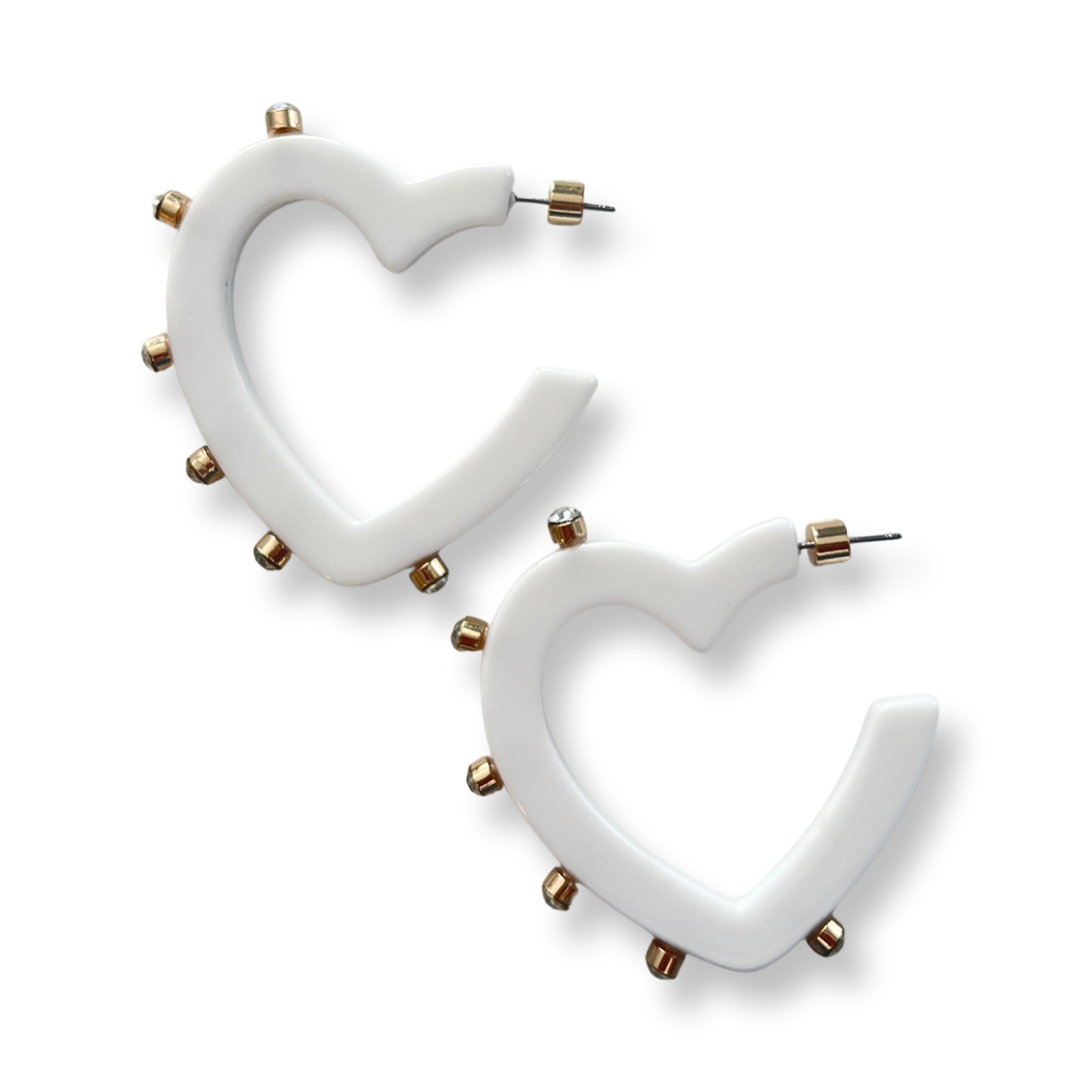 white heart shaped earring with round crystal stones