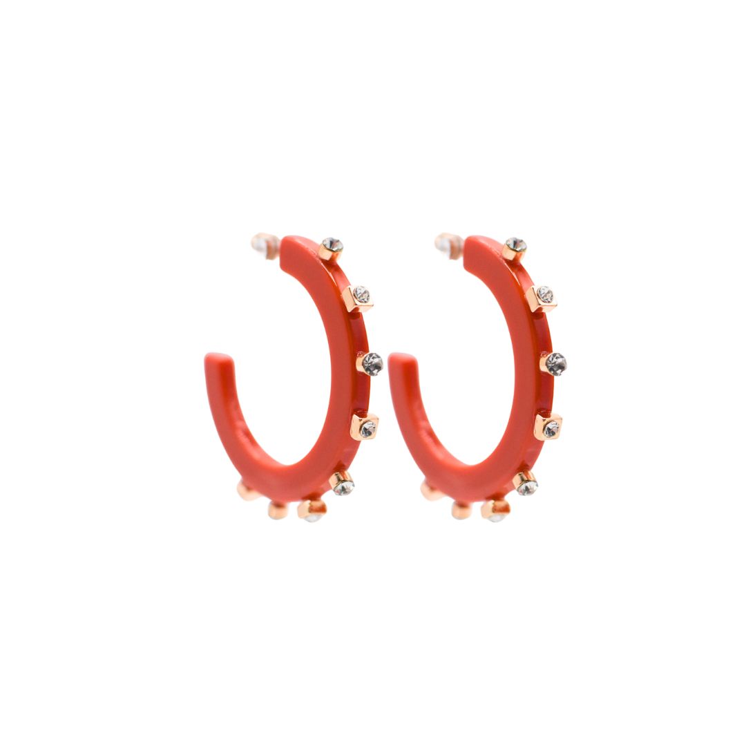 Large red open hoop earrings with gold-tone square and round crystal studs along the outer edge, paired with clear post backings for a sleek finish.