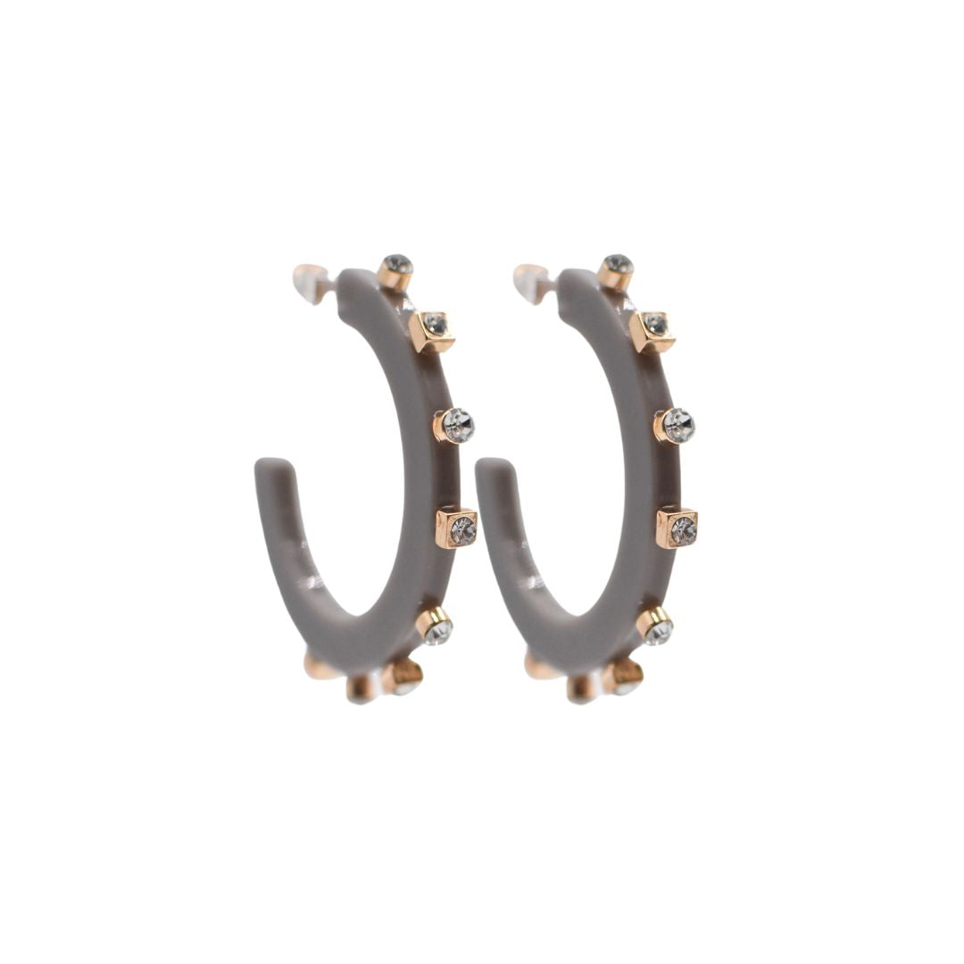 Large matte slate grey open hoop earrings adorned with gold-tone accents and crystal studs, featuring a lightweight, modern design and clear post backings.