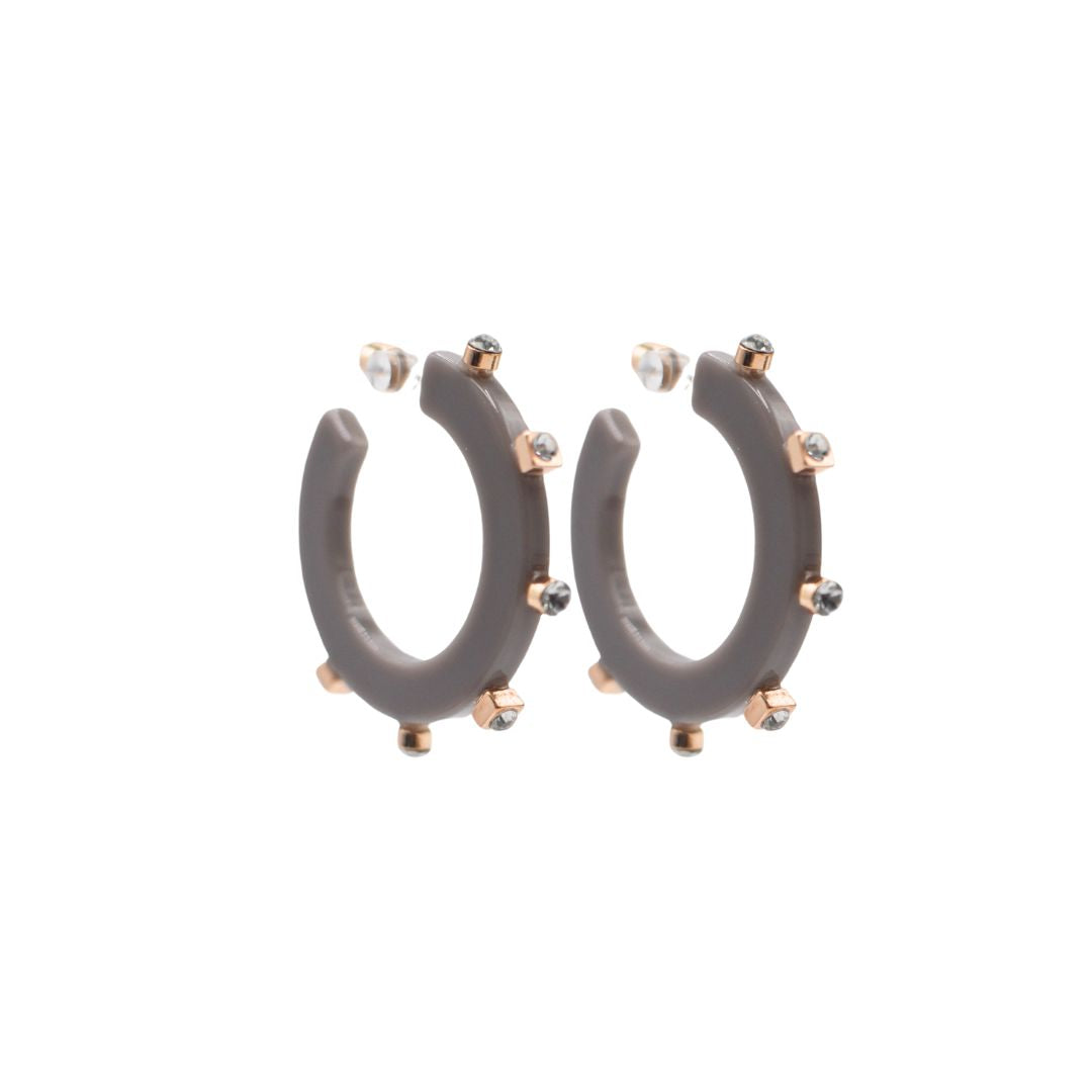 Small matte slate grey open hoop earrings adorned with gold-tone accents and crystal studs, featuring a lightweight, modern design and clear post backings.