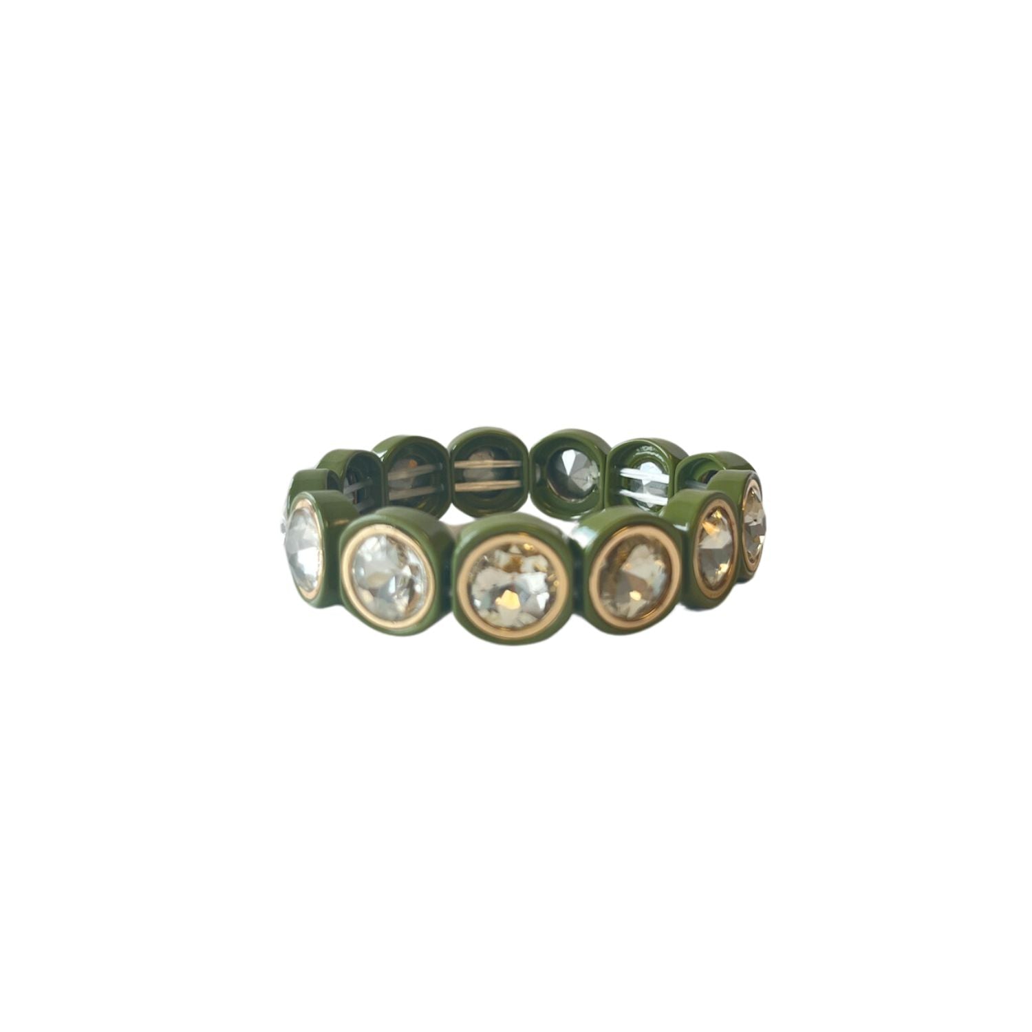 A close-up of an acrylic stretch bracelet in olive green, featuring round, crystal-like stones set in gold circular bezels that reflect light.