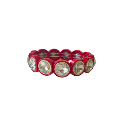 A bright red acrylic bracelet featuring large round crystals, each encased in gold rounded settings, connected by a stretchable elastic structure.