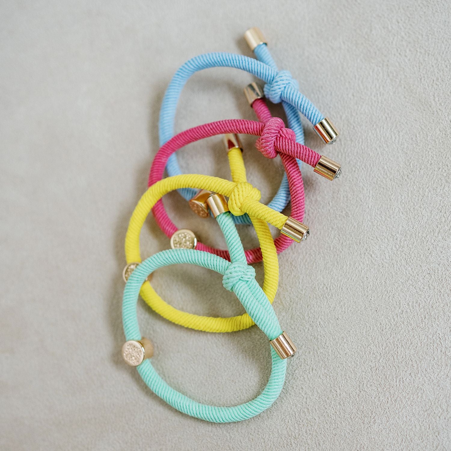 set of 4 bracelet hair tie set , yellow, mint, baby blue, magenta. 