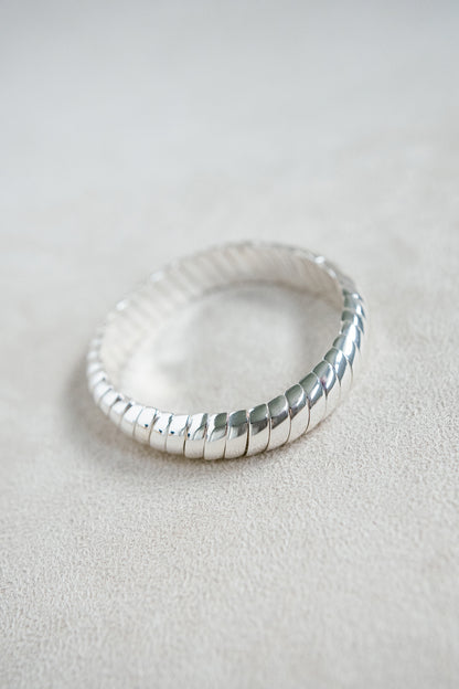 Enamel Silver Coil Stretch Bracelet with linking design for an elevated and sophisticated look.