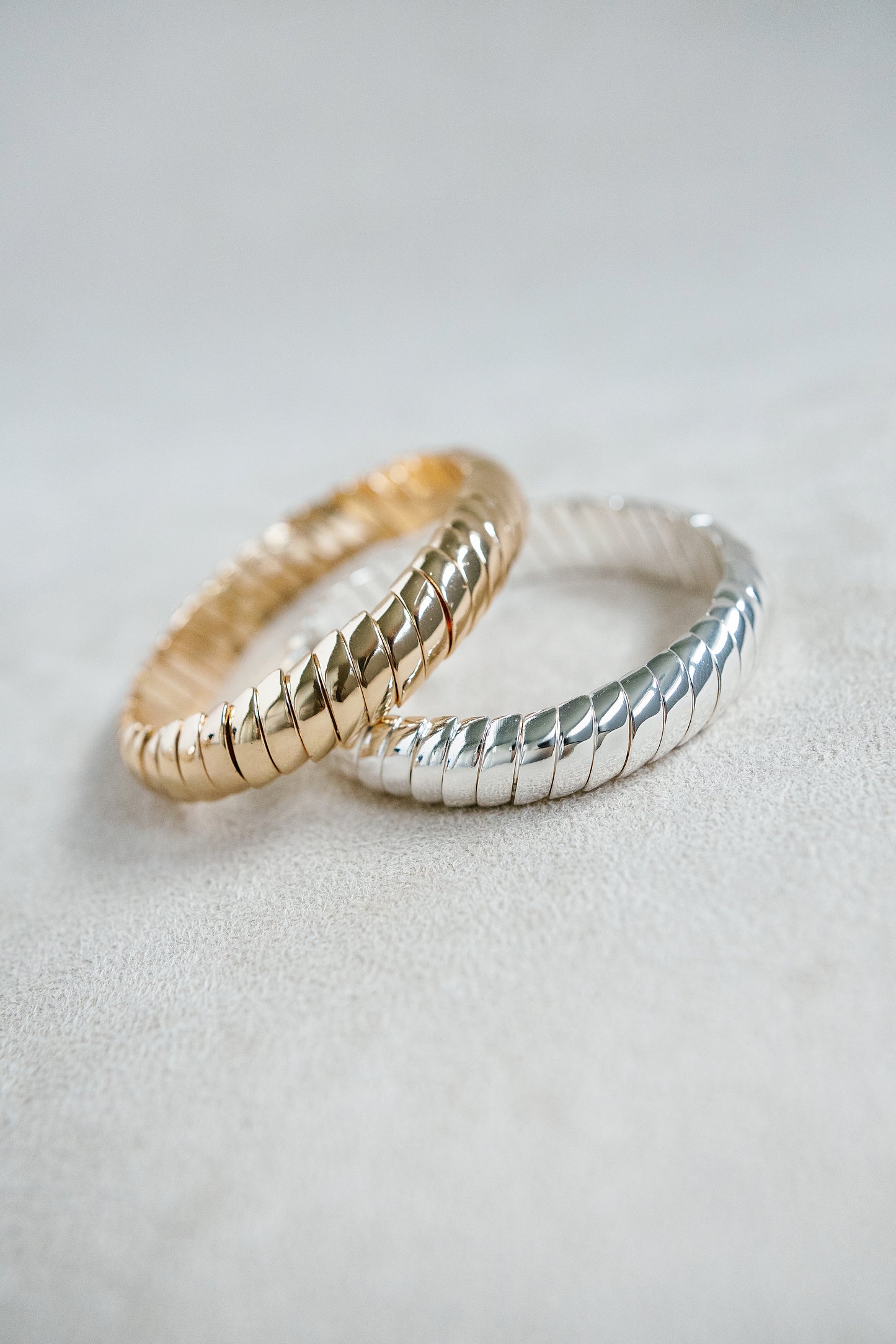 Silver and Gold Coil Stretch Bracelet with sleek and timeless style. 