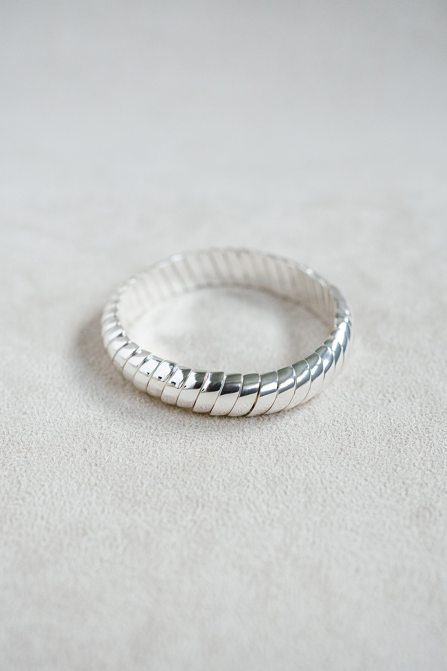 Enamel Silver Coil Stretch Bracelet with linking design for an elevated and sophisticated look.