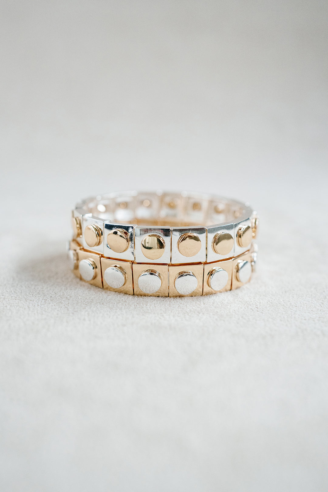 Geometric Silver and Gold Mixed Metal Enamel Stretch Bracelet with Contrasting Stud Details. 