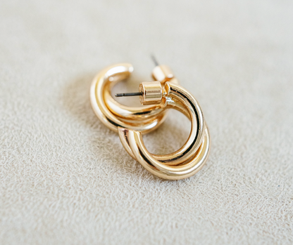 gold twisted hoop earring with post. 