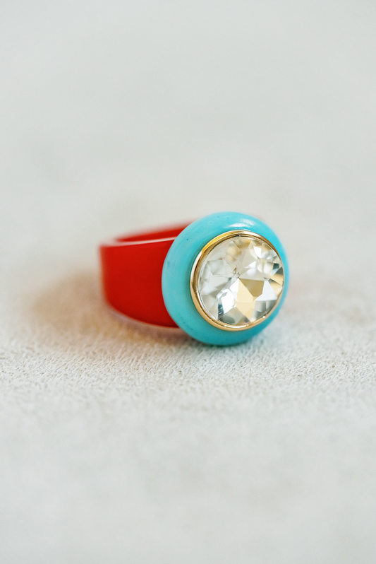 Your new favorite Cocktail Ring! Acrylic base ring with round jewel center , lightweight , gold edged detail around center stone.