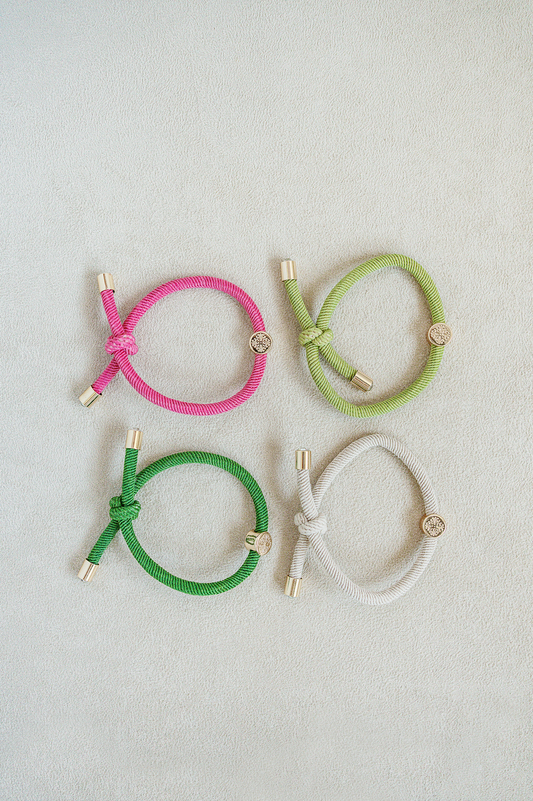 Hair Tie Set set of 4 - knotted hair tie that looks cute on your wrist and in your hair! Knotted detail and gold end caps with jewel center stone. Pink and Green.