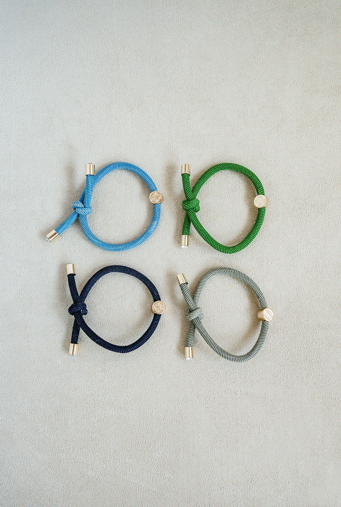 Hair Tie Set set of 4 - knotted hair tie that looks cute on your wrist and in your hair! Knotted detail and gold end caps with jewel center stone. Blue,Green,and Grey