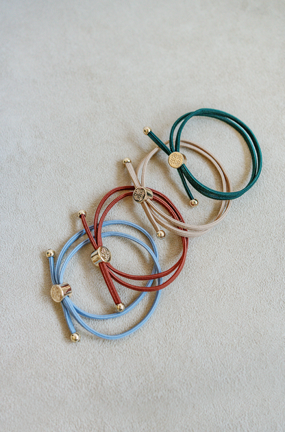 Two in one sleek hair tie bracelet set in dark green, khaki, rustic red and dusty blue.