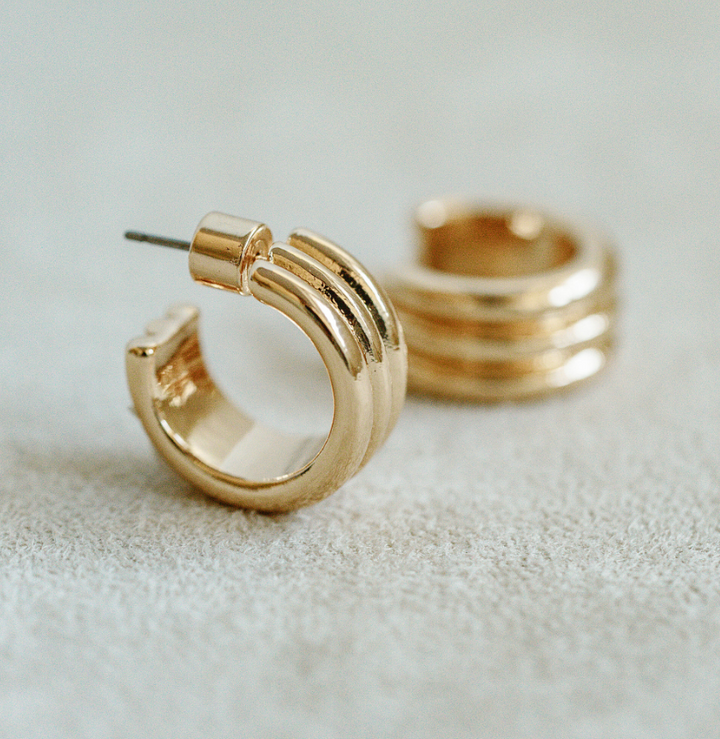 Gold 1/2 inch mini hoop with triple hoop connecting detail for timeless and classic look. Easy everyday gold plated hoop earring.