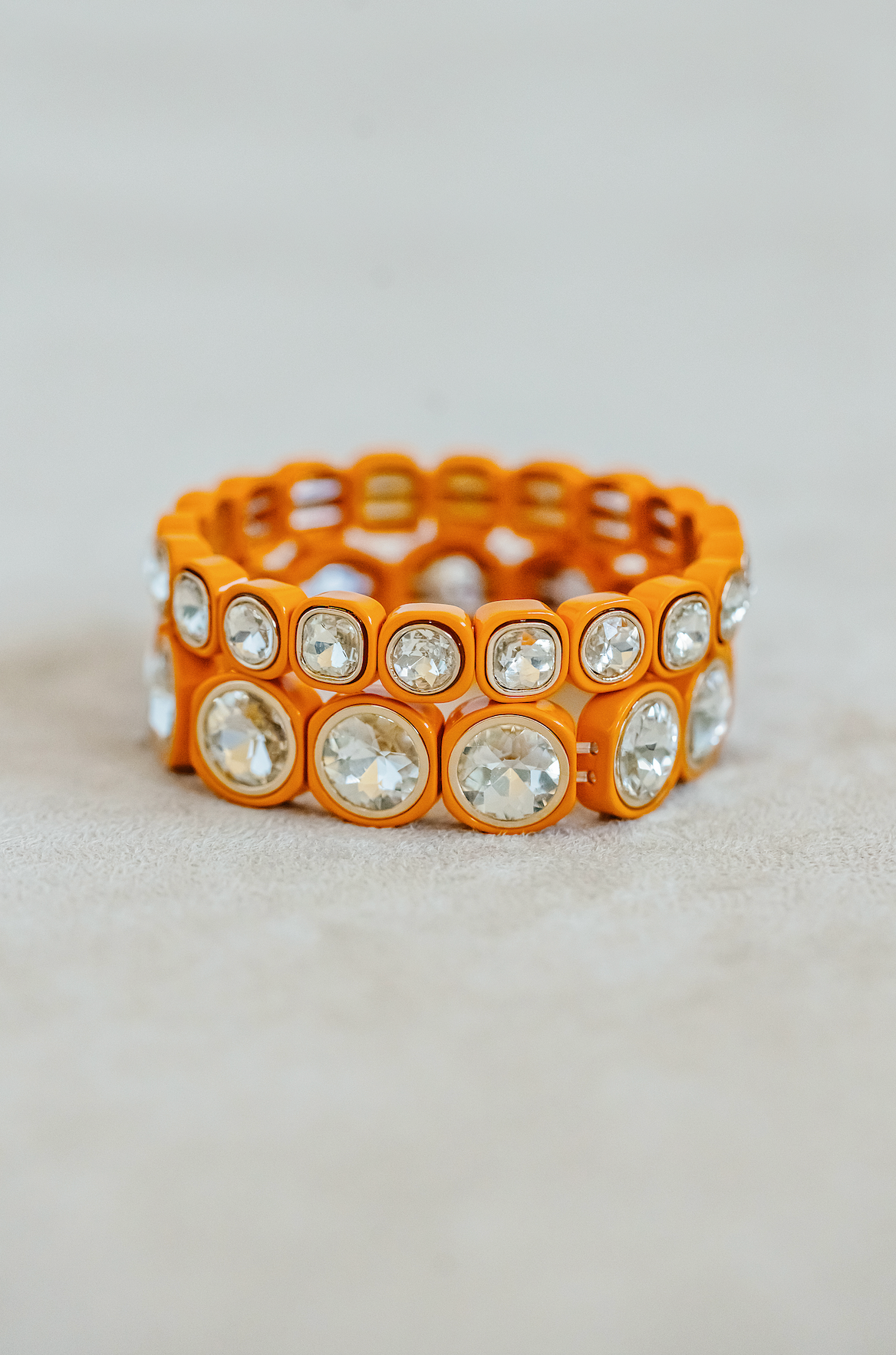 Round and Petite Stretch Bracelets in orange. Bright and fun bracelets for stacking.