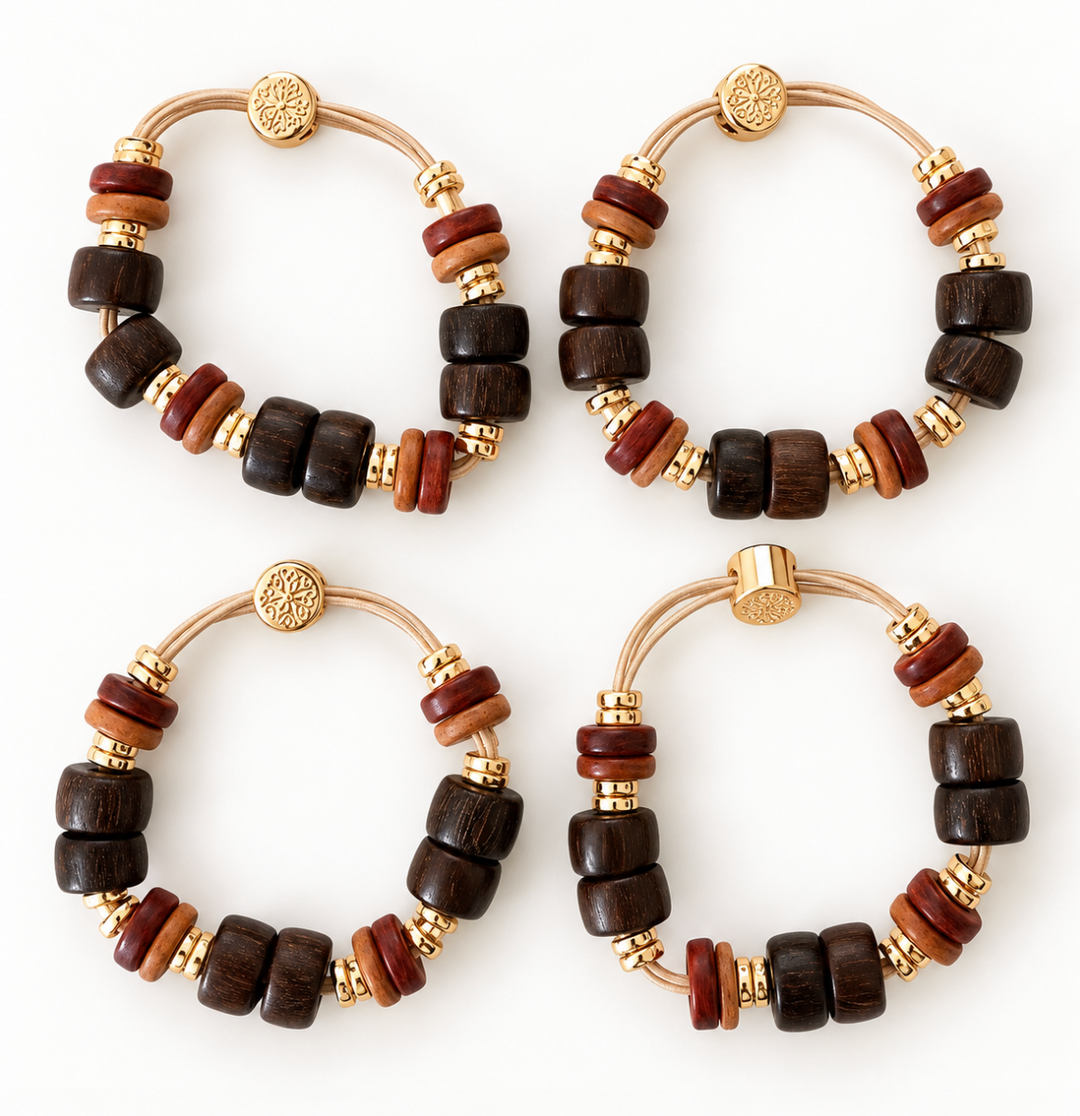 Four matching beaded bracelets arranged in a 2x2 grid on a white background. Each bracelet features dark and medium brown wooden beads, small gold spacer beads, and a gold-toned metal clasp with a round medallion.
